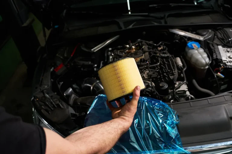 Mechanic inspecting an engine air filter