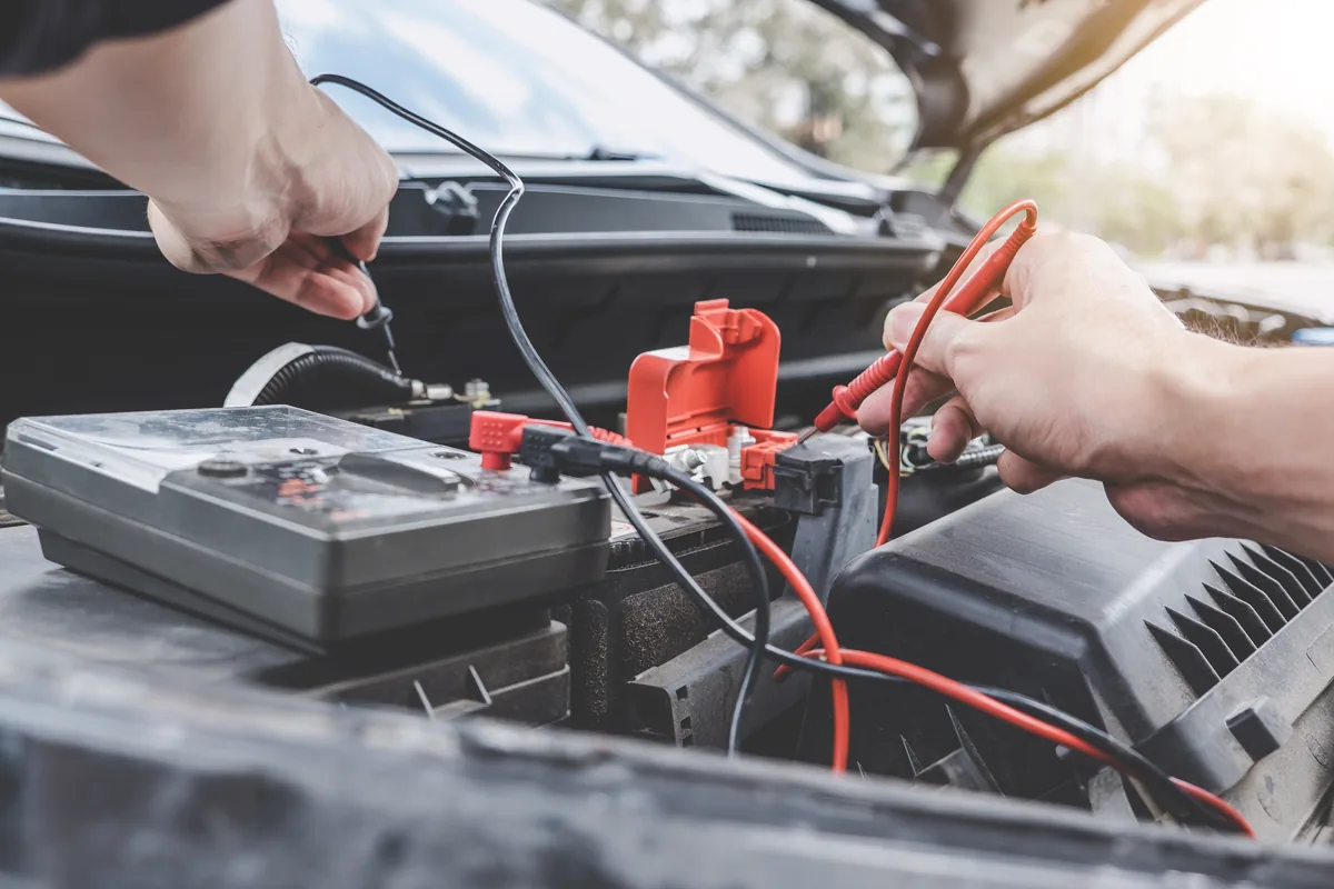 Diagnostic testing being carried out on a car battery